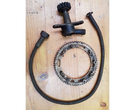 A pre- war speedo drive, bracket and cable.