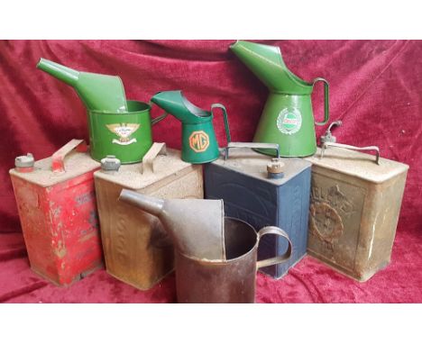 Four petrol cans with brass caps, PRATTS, SHELLMAX, ESSO and SM 7 BP, together with four oil jugs (8).