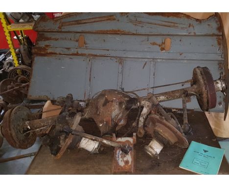 An Alvis TD21 rear axle with wire wheel hubs, a pair of front wire wheel hubs, a boot floor, a bracket and a spares book.