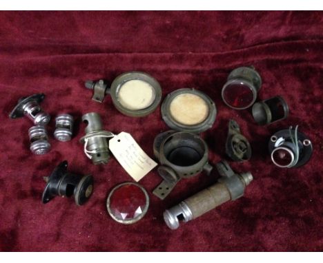 Various King of the Road lamp holders and two brass tax disc holders.