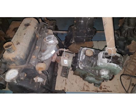 A Reliant engine with gearbox, and two unknown gearboxes, unknown condition (3).