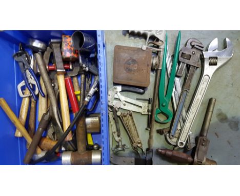 A quantity of motorcar related tools, including hammers and dollies.