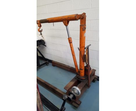 An Epco heavy duty hydraulic engine hoist, with extendable arm, on four wheel lockable wheels.