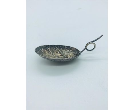 A Silver Caddy spoon of leaf design, hallmarked Birmingham 1874.