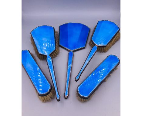 A dressing Table brush set with arctic blue enamel backs.