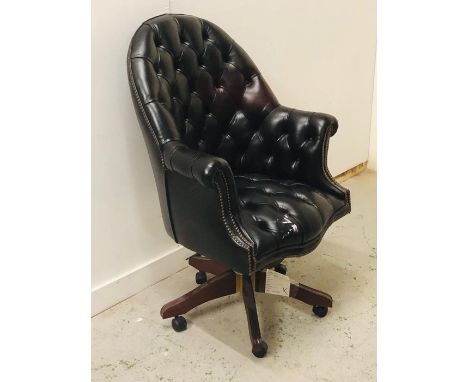 A Large button back leather club style captains chair