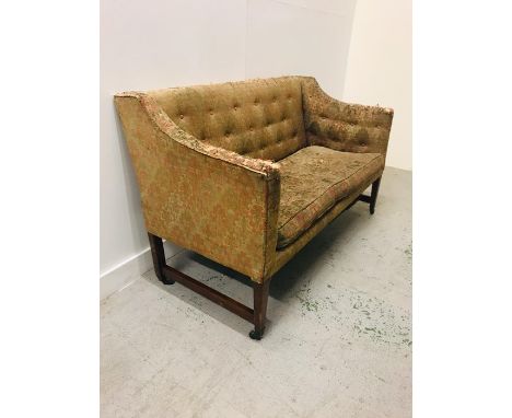 A Regency Mahogany framed sofa with rectangular back and brass castors.