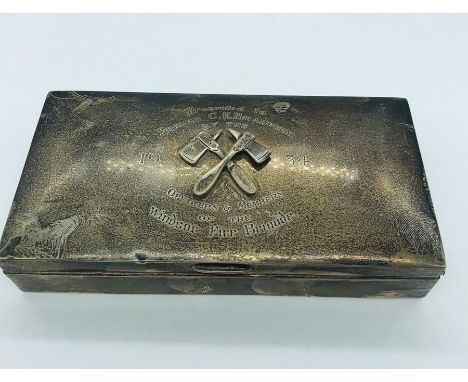 A Windsor Fire Brigade silver cigarette box, hallmarked Birmingham 1933-34, makers mark WWC, with raised cross Fireman's Axe 