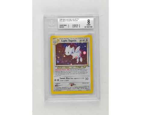 Pokemon TCG. Neo Destiny Unlimited Light Togetic Holo 15/105 graded Beckett 8.Condition Report:  Graded Beckett 8. 