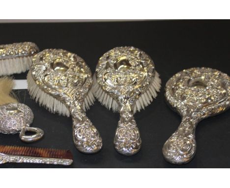 A Victorian six piece silver mounted dressing table set, by William A Hayes, assayed Birmingham 1898, comprising hand mirror,