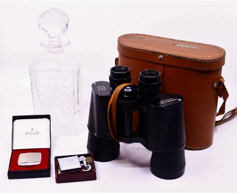 A pair of Goutz binocular in case together with a Ronson plated lighter in box, a Parker plated tape measure in box and a cut