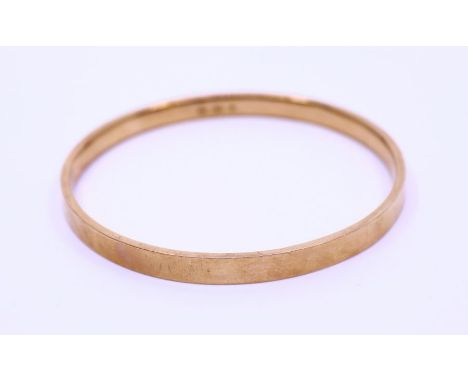 9ct gold slave bangle. weight:10.84g approx, diameter: 7.5cm approx.