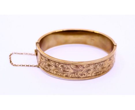 A 9ct leafage engraved bangle approx. 21g