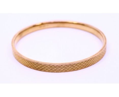 15ct gold slave bangle. Weight: approx. 18.78g, diameter: approx. 8cm