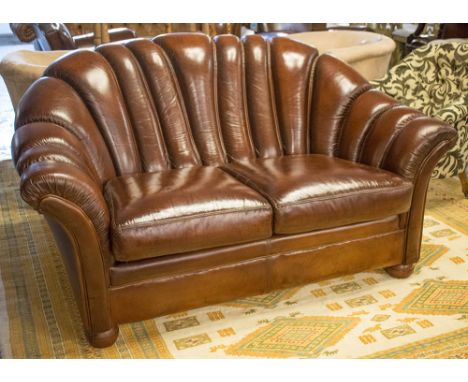 SOFA, Art Deco style in brown leather with scalloped back and two seat cushions, 156cm W.