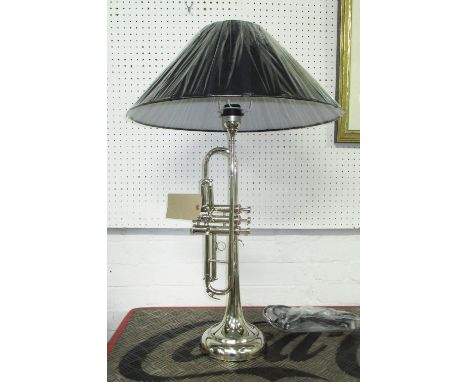 TABLE LAMP, in the form of a trumpet in chromed metal with shade, 80cm H.