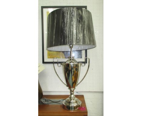 TABLE LAMP IN THE FORM OF A TROPHY, in chromed metal with shade, 90cm H.