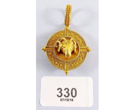 A Victorian yellow metal Castellani style pendant in the form a rams head