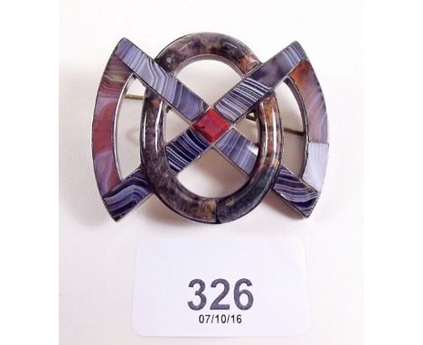 A Celtic white metal interlaced brooch set agates 