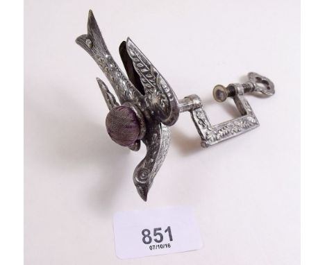 A Victorian 'hemming bird' sewing clamp with pin cushion and clip beak 