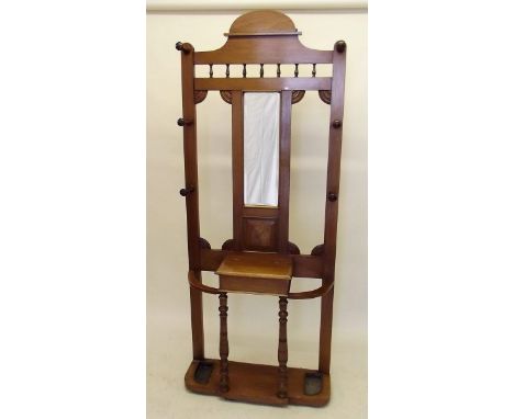 An oak Edwardian hallstand with mirror and stick stands