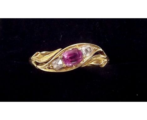 A Victorian gold gypsy ring set ruby flanked by two diamonds, circa 1860
