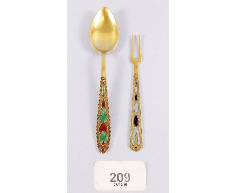 A Russian silver gilt enamel spoon and pickle fork