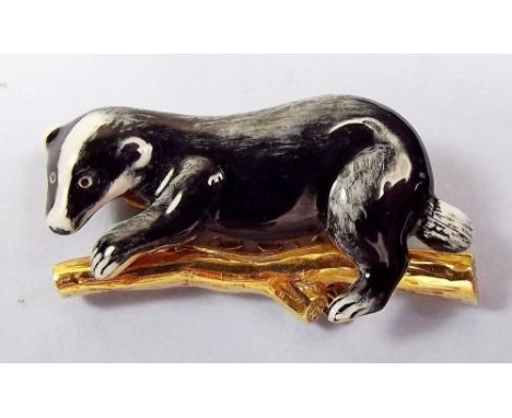 An early 20th century 18 carat gold and enamel brooch in the form of a badger 