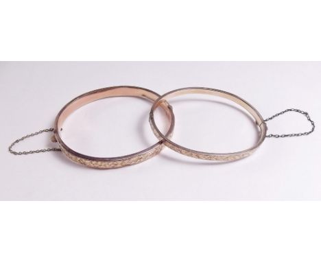 A 9ct gold hinged bangle and another 11g