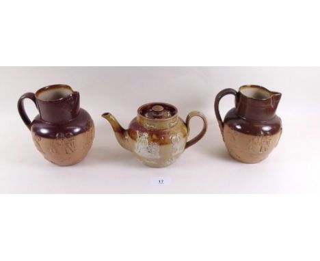 Two Royal Doulton Lambethware jugs and a teapot 