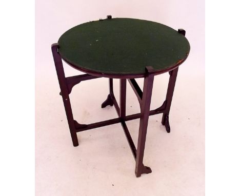An early 20th century folding table with reversible card table or mahogany top 