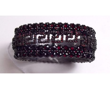 A Victorian garnet set bangle 