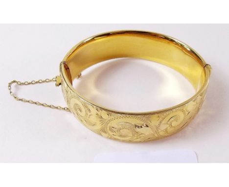 A rolled gold bangle 