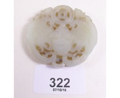 A  Chinese carved green jade pendant 