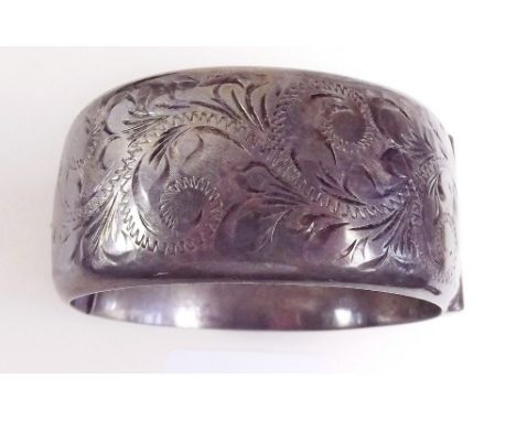 A engraved silver bangle 