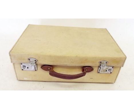 A vintage cream pigskin suitcase 