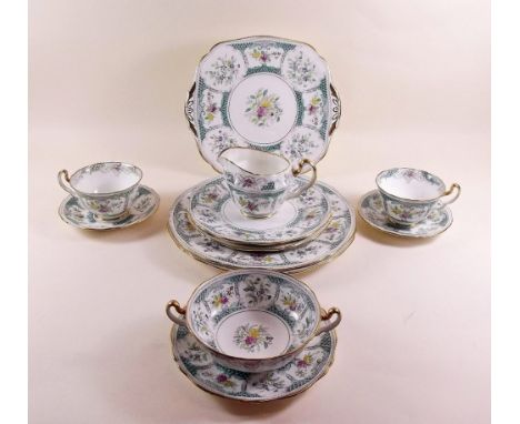 An Adderley tea and dinner service 'Lowestoft' comprising: six cups and saucers, seventeen tea plates, six side plates, cake 