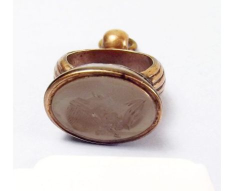 An antique gold plated seal with carved intaglio portrait 