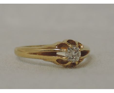 A yellow metal signet ring having a diamond inset to open claw set shoulders, marks worn tested as 18ct gold, size P3.1G