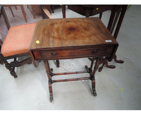 A late 20th century mahogany sofa table in the period style having typical drop flap and drawer top on spindle frame