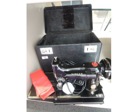 A vintage sewing machine by Singer, model 222K in fitted case 