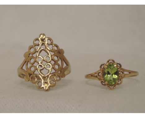 A lady's dress ring having a peridot style stone in claw set mount on 9ct gold loop, size P and another 9ct gold ring having 