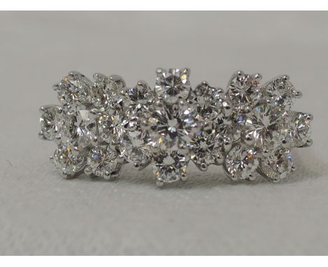 A lady's dress ring having a trio of brilliant cut diamond daisy clusters, total approx 2ct, in a claw set basket mount on an