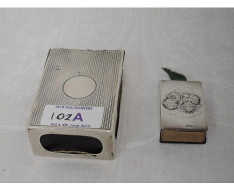 Two Edwardian silver match box holders including an oversized silver match box holder having engine turned decoration and pla