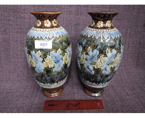 A pair of Doulton Lambeth stoneware vases having floral enamel decorationCRACK TO BACK OF ONE VASE