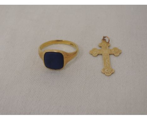 A gent's yellow metal signet ring stamped 18ct having an inset blue stone,  approx 5.2g, and a yellow metal cross pendant sta