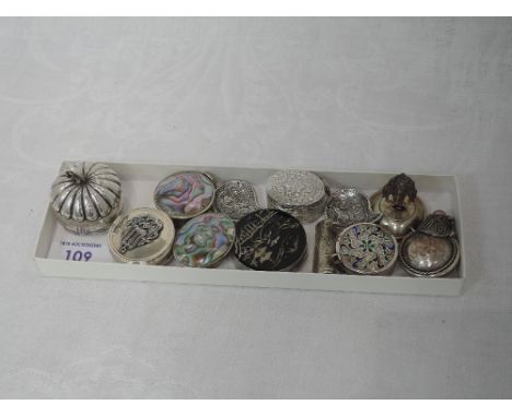 A selection of white metal patch/pill boxes of various forms, including Mexican, Japanese, enamelled etc, two filligree trink