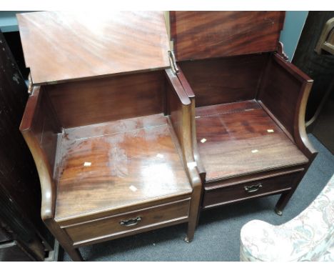 Two early 19th century mahogany near matching commode seats having lift tops and bases on tapered legs