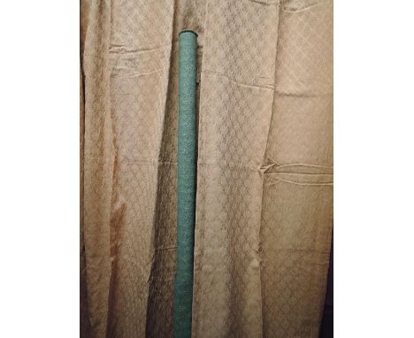 A part roll of green upholstery fabric and a pair of champagne coloured floral curtains from around 1940s.