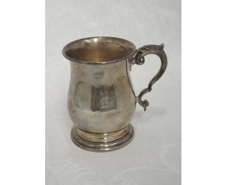 A plain silver tankard of baluster form having engraved monogram and moulded handle, London 1963, C J Vander LtdINITIALS ENGR